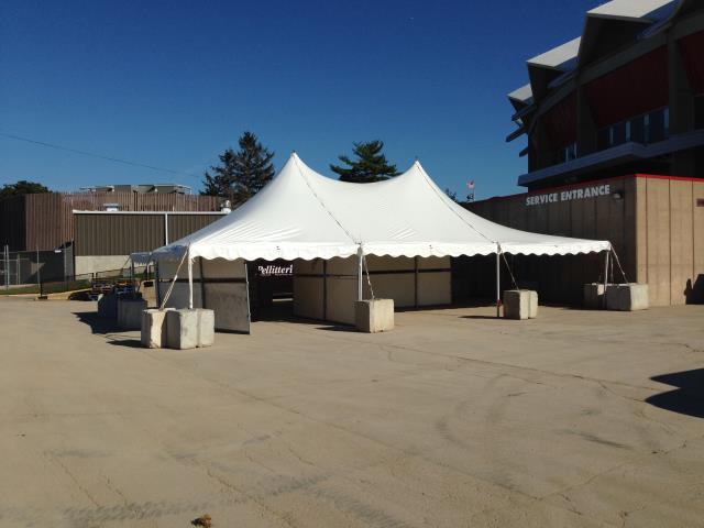 30 foot wide white pole tent rental on concrete.
