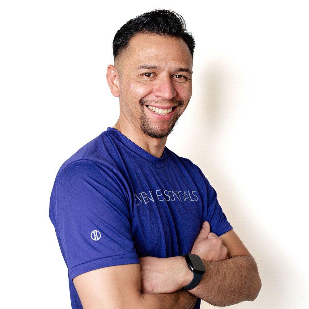 Headshot of Osman Galo in a purple Event Essentials T-shirt.