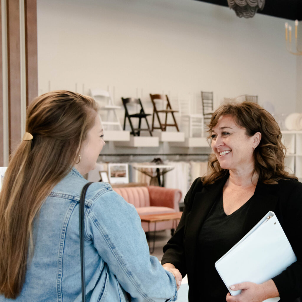 Customer shaking hands with Event Essentials team member.